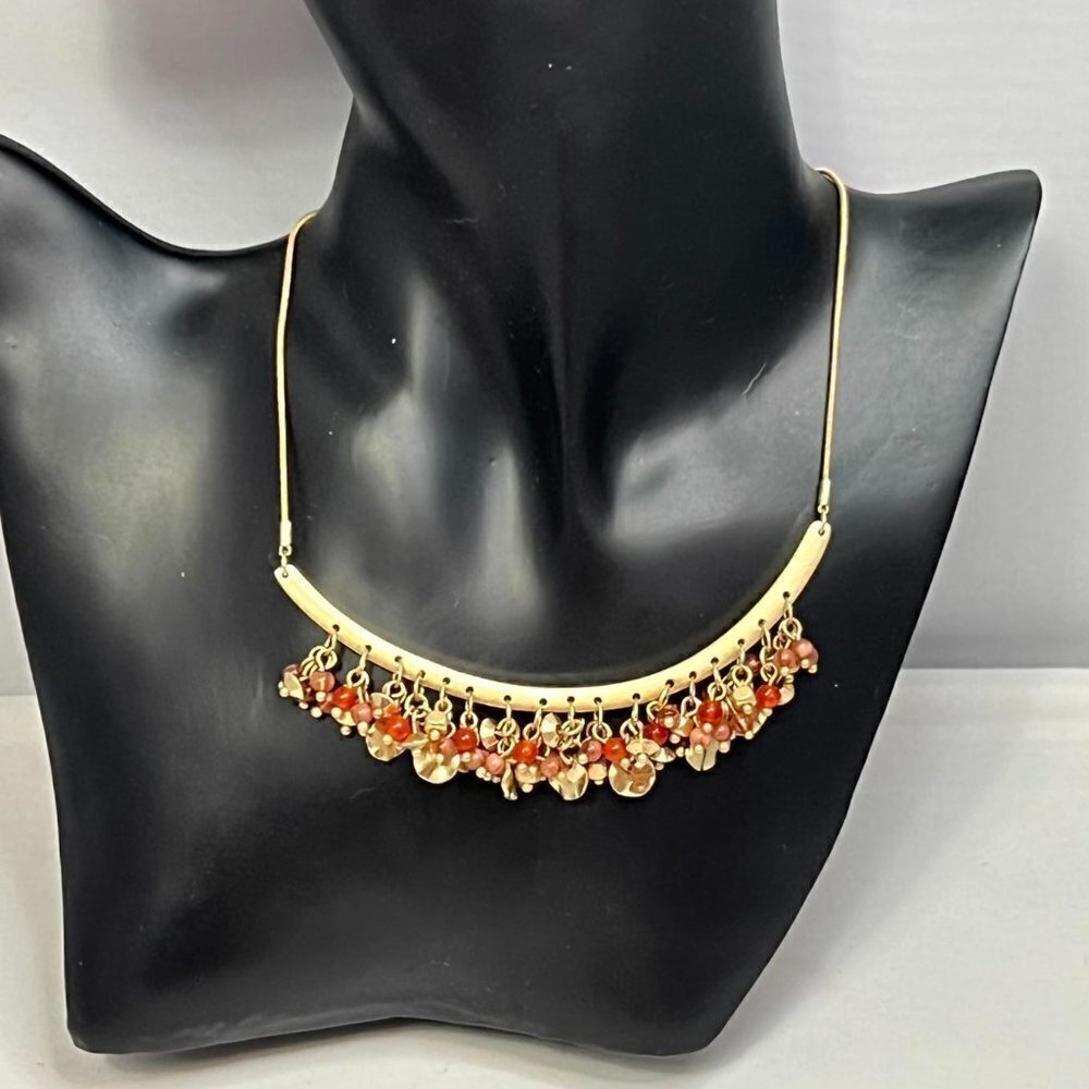 Ballet gold tone curved bar with dangling pink/coral gold beads